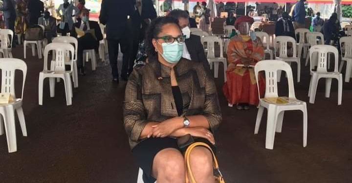 US Ambassador to Uganda Natalie Brown seated in a plastic chair at Museveni's swearing-in ceremony