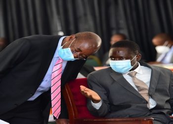 The chair of the Budget Committee, Hon Lugoloobi(L) withthe State Minister for finance, Hon Bahati during the debate on the budget