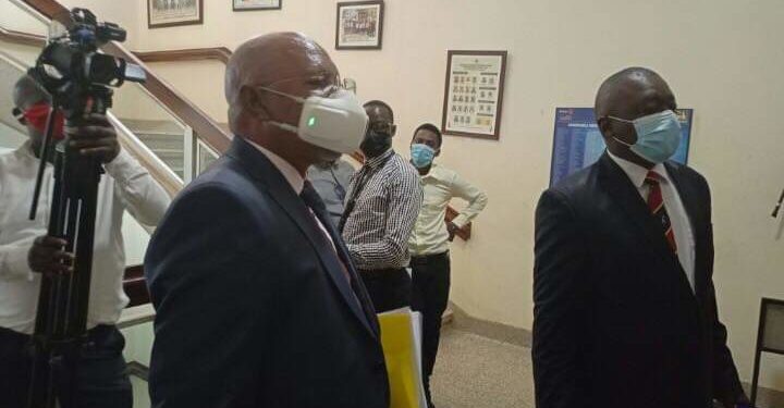 Gen Jeje Odongo putting on an expensive face mask on Tuesday