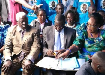 FDC national chairperson Wasswa Biriggwa, FDC president Patrick Amuriat and Joyce Ssebugwawo