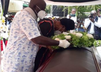 Gen Katumba and wife Catherine during the burial of their daughter Brenda on Thursday