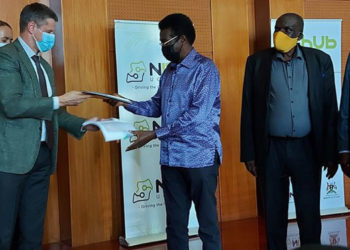Security Minister Jiim Muhwezi after inking deal with Russian company