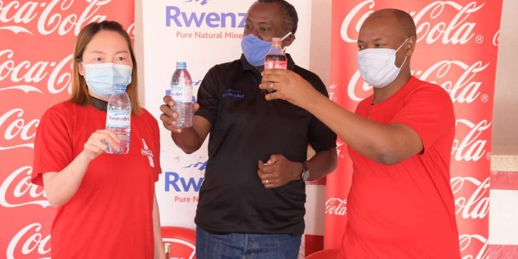 Jackie Gong Younting, a Director at FengHuang, Coca-Cola Beverages Africa Public Affairs & Communications Director, Simon Kaheru and Samuel Kangave, PRI Manager during the MoU signing.