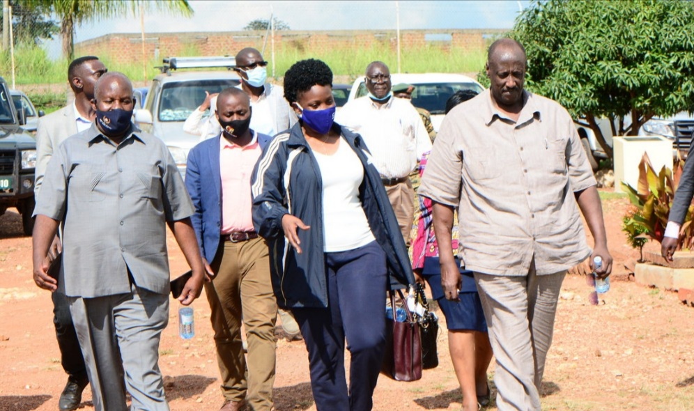 Lands Minister Judith Nabakooba with OWC Chief Coordinator Gen Salim Saleh at Purongo Grain Hub in Nwoya District.