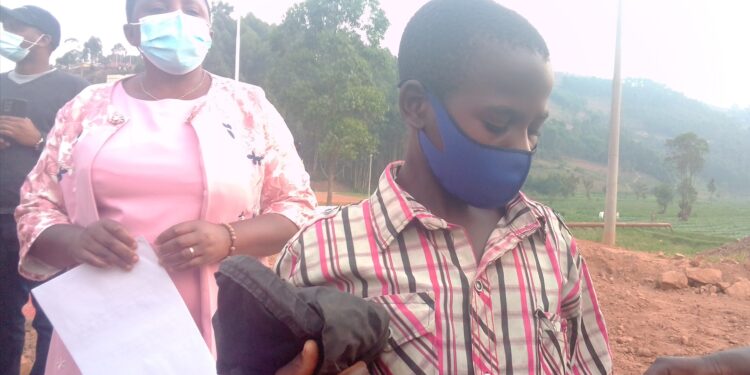 Ugandan boy being handed over to Ugandan authorities on Sunday