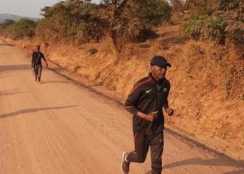 Gen Kayihura making road work exercise on Sunday