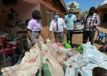 Pablo Bashir (white shirt) celebrates birthday with children with disabilities by donating items worth millions of shillings.