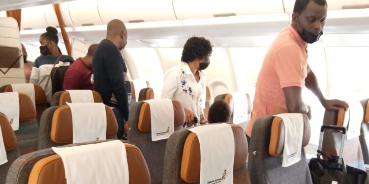Some of the passengers who took a flight to Dar es Salaam using Uganda Airlines' new Airbus