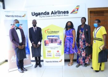 Henry, Dhabangi, Airline's Doreen, Maama Rebecca and Henry's mother at Uganda Airlines Offices on Thursday