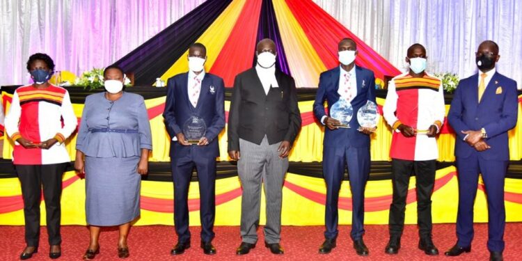 The Speaker of Parliament, Jacob Oulanyah (Centre), with Prime Minister Robinah Nabbanja; Sports State Minister Denis Hamson Obua and Uganda’s team to the 2020 Tokyo Olympic Games.