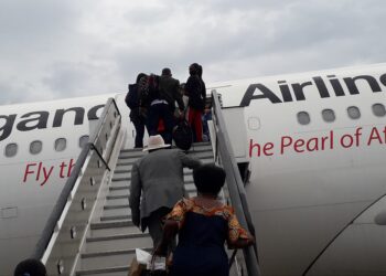 Passengers boarding Uganda Airlines Airbus