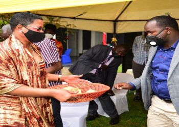 Deputy Speaker, Anita Among with a basket at the fundraising for the church