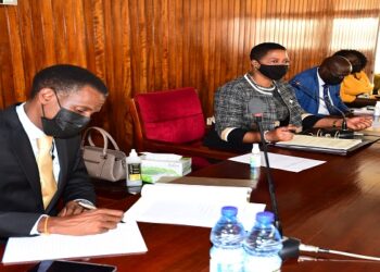 The Deputy Speaker(C) addresses the MPs from the affected regions. On her right is the Attormey General, Hon Kiwanuka Kiryowa