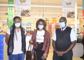 (L-R) : Gonzaga Kajja; Deputy Manager, Carrefour Naalya at Metroplex Mall with Sylivia Namagembe, Headteacher Kireka Home for the Children with Special Needs and her deputy; Gertrude Lyaka at the launch of the “Round Up you Bill” campaign.