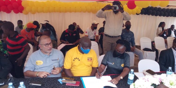 Uganda Airlines CEO Jennifer Bamuturaki and FMU President Dipu Ruparelia sign partnership