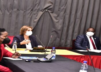 Izabela Karpowicz(C) briefs the LOP, Hon Mpuuga and other MPs during the meeting at Parliament