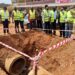 The RCC Mbale, (In checked jacket) listens carefully to the Project Engineer during the site inspection visit on Naboa Road, Mbale City