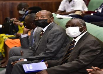 Muruli Mukasa with the Finance State Minister Amos Lugoloobi during the debate