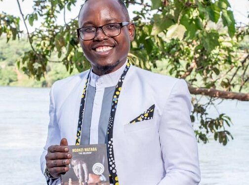 Growth Coach Ngonzi Wataba posing with his recently published book