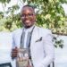 Growth Coach Ngonzi Wataba posing with his recently published book