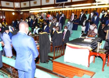 MPs bowing in prayer shortly before commencing deliberations.