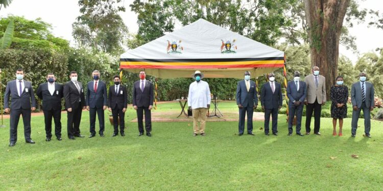 President Yoweri Museveni in a group photo with the Turkish Ambassador to Uganda H. E Kerem Alp after a meeting  as they discussed issues about the Turkish construction Companies operating in Uganda, the meeting took place at the State House Entebbe on 26th October 2021. Photo by PPU/Tony Rujuta.