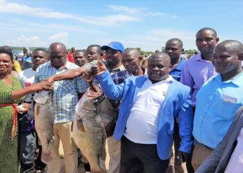 A file photo of Hon Janet Okori-Moe (2nd, left) during a field visit to Dolwe Islands in Busia district