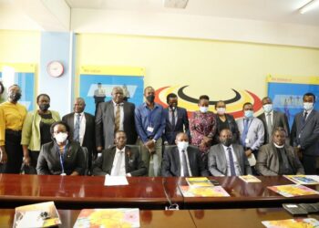 (L-R) Registrar General, Mercy K. Kainobwisho, Board Chair, Amb. Francis K. Butagira in a group picture with Board Members & Staff after the Launch of the Trademark Filing System.