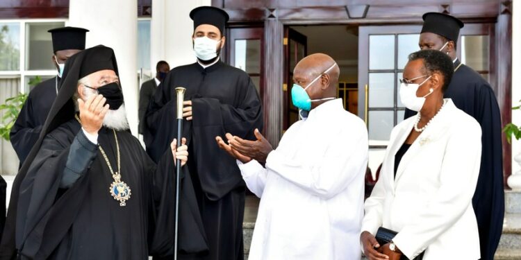 President Museveni and First Lady Janet Museveni share a moment with the Pope an Patriarch of Alexandria and All Africa Beatitude Theodoros II (2nd L) and his delegation after a meeting at Entebbe