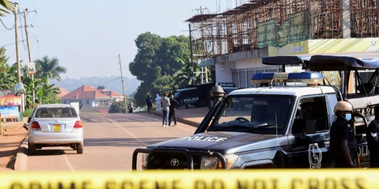 Ugandan police members secure the scene of an explosion in Komamboga, a suburb on the northern outskirts of Kampala, Uganda October 24, 2021. REUTERS/Abubaker Lubowa