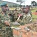 Eyali omuduumizi wa Mggye ga UPDF Gen. David Muhoozi bwe yali atongoza omulimu gw'okuzimba eddwaliro