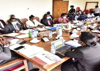 Committee on Cosase chaired by Joel Senyonyi(L) meeting officials of URC