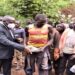 The Leader of the Opposition, Hon Mathias Mpuuga (L) meeting meeting artisan miners at Nakyooga in Kabale district