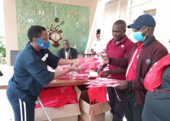 MP Betty Nambooze handing over Kabaka Birthday run kits to her constituents