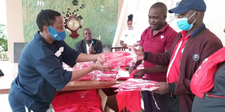 MP Betty Nambooze handing over Kabaka Birthday run kits to her constituents