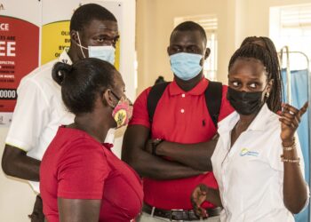 R-L Daisy Kandole and other YAM Members during an Outreach in Kitebi