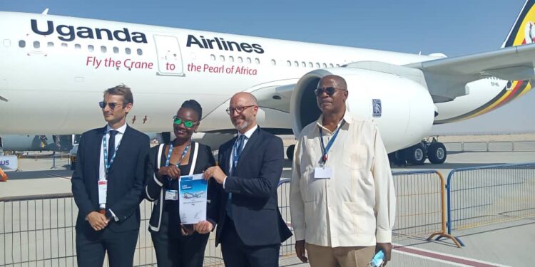 Uganda Airlines boss Jennifer Bamuturaki (2nd L) with Airbus’ Houari (2nd R) after signing the deal