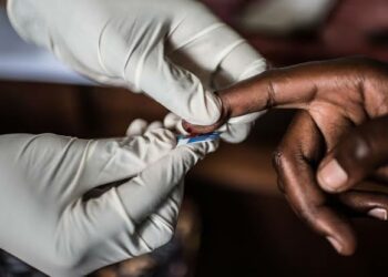 Doctor conducting HIV/AIDS test