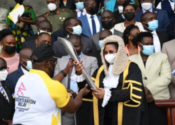 The Deputy Speaker, Anita Among, receiving the Commonwealth Games Baton at Parliament.