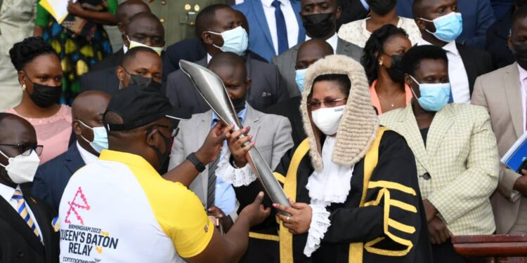 The Deputy Speaker, Anita Among, receiving the Commonwealth Games Baton at Parliament.