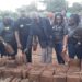 Uganda Airlines staff lay bricks to be used for Dhabangi's house construction