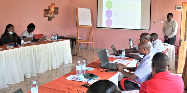 Dr Peter Ibembe addressing Advance Family Planning Uganda members at Kyangabi Crater Resort