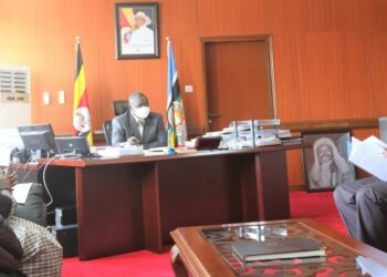 Speaker Oulanyah listening to Robert Odong presenting the PPTIA petition. Left is Hon Faith Nakut