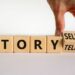 Storytelling or storyselling symbol. Businessman turns wooden cubes and changes the word 'storytelling' to 'storyselling'. Beautiful white background, copy space. Business and storytelling concept.