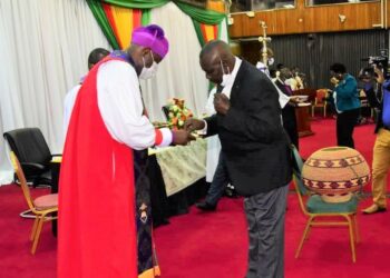 Speaker Jacob Oulanyah, receiving Holy Communion during the Christmas Carol and Holy Communion service at Parliament