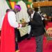 Speaker Jacob Oulanyah, receiving Holy Communion during the Christmas Carol and Holy Communion service at Parliament