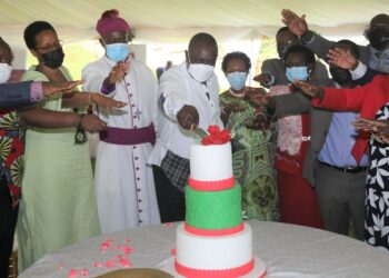 The Speaker of Parliament, Jacob Oulanyah, Archbishop Kazimba and MPs cut cake in celebration of 60 years of existence of the Anglican Church.