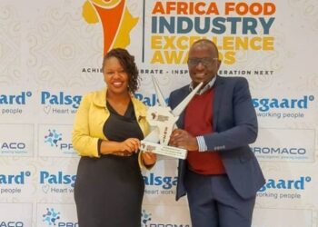 Uganda Commercial Director Isaac Sekasi and Vivienne Olenyo, Frontline Marketing Manager – Uganda, Coca-Cola East and Central Africa Franchise after receiving the award