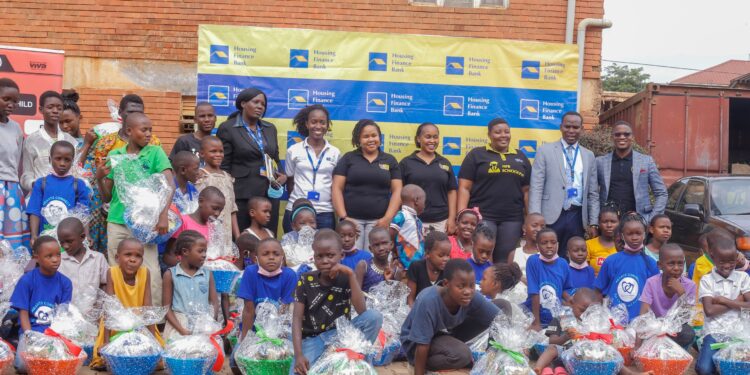 Housing Finance Bank team pose with CRANE children after handing over the hampers