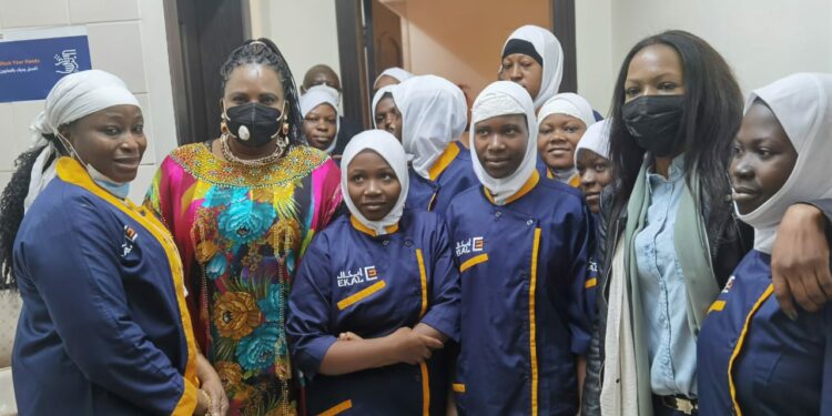 Minister Amongi (second left) with Ugandan girls at the EKAL facility in Saudi Arabia on Tuesday